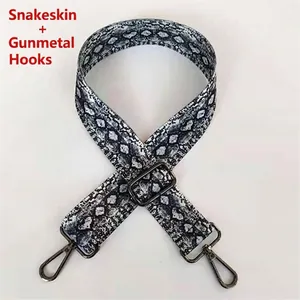 Adjustable snakeskin pattern shoulder strap with gunmetal hardware and hooks
