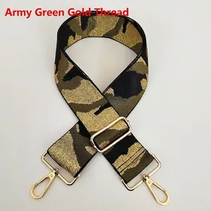 Detail of army green camouflage strap with gold thread and metallic lobster clasps