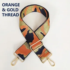 Detail of adjustable camouflage jacquard bag strap with orange and gold threads