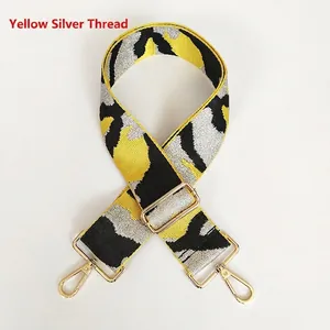 Detail of wide jacquard replacement strap with yellow, black, and silver woven pattern