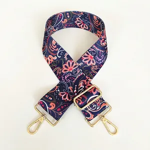 Detail of adjustable paisley morning glory canvas strap with gold swivel hooks