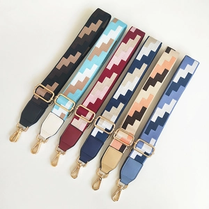 Adjustable woven shoulder straps with geometric patterns and golden metal swivel hooks