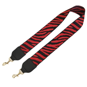 Wide red and black zebra print bag strap with durable fabric and gold lobster clasps