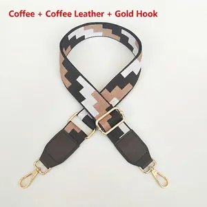 Close-up of adjustable bag strap with coffee geometric patterns and gold metal hardware