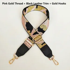 Detail of adjustable camouflage bag strap with pink gold thread and black leather ends