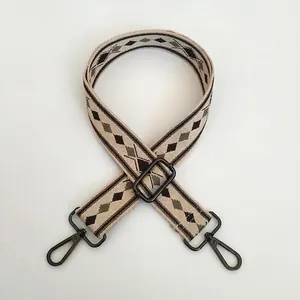 Adjustable wide shoulder strap with embroidered green and brown diamond pattern and gunmetal hooks