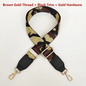 Detail of adjustable camouflage bag strap with gold glitter weaving and metal swivel hooks