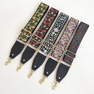 Ethnic style floral embroidered shoulder strap with gold metal hooks and leather accents