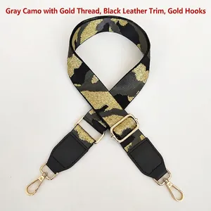 Detail of adjustable camouflage bag strap with grey gold thread and black leather