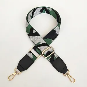 Adjustable camouflage strap with green silver thread, black leather, and gold hooks
