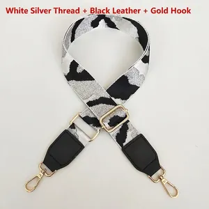 Detail of leopard print bag strap with silver metallic thread and gold lobster claws