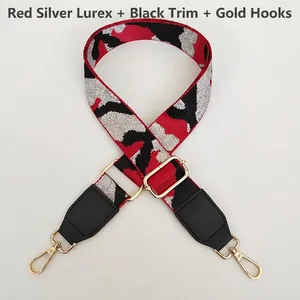 Detail of red and silver camouflage jacquard bag strap with golden metal hook
