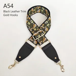 Ethnic style floral jacquard bag strap with black leather ends and gold lobster clasps