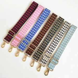 Adjustable wide shoulder strap with houndstooth jacquard pattern and gold metal buckles
