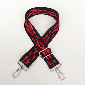 Adjustable black bag strap featuring red flame pattern with silver metal lobster clasps