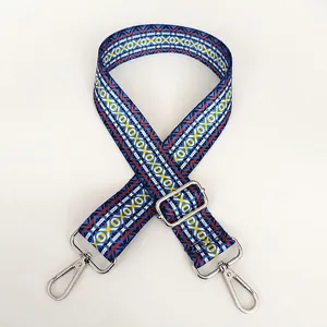 Detail of adjustable ethnic style bag strap with silver swivel metal hooks