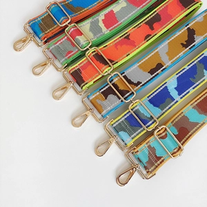Detail view of various colorful jacquard woven wide nylon replacement straps for bags