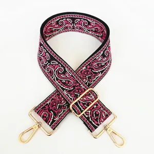 Detail of No. 16 woven strap with pink paisley pattern and golden metal swivel hooks