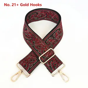 Close-up of No. 21 ethnic paisley canvas strap with gold metal hooks and adjustable buckle