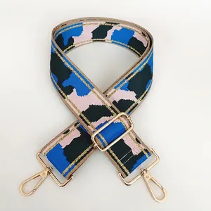 Adjustable wide nylon shoulder strap with colorful geometric pattern and gold metal hooks