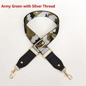 Macro view of adjustable camouflage bag strap with army green silver thread and gold hardware