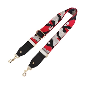 Adjustable woven shoulder strap for bags with red camouflage pattern and gold buckles