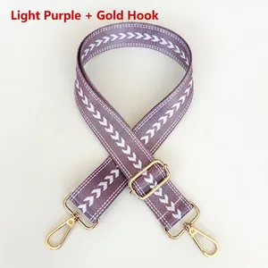 Adjustable light purple jacquard shoulder strap with white chevron patterns and gold hooks