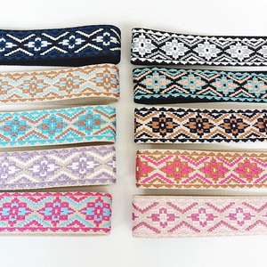 Collection of wide canvas guitar straps with colorful bohemian geometric jacquard patterns
