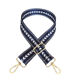 Adjustable dark blue nylon strap for cross-body bags with white V-pattern and gold hardware