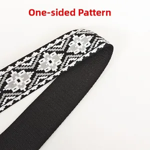 Detail of single-sided pattern on wide canvas strap with black and white geometric jacquard