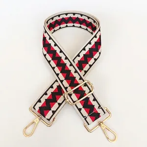 Adjustable wide replacement bag strap with red and black geometric zigzag patterns