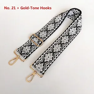 Detail view of woven diamond pattern bag strap with adjustable gold lobster clasps