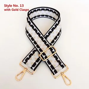Close-up of geometric zigzag weave strap with gold metal buckles and lobster clasps