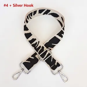 Detail of adjustable embroidered shoulder strap with black and white zebra pattern