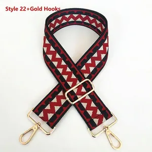 Close-up of ethnic geometric weave bag strap with gold metal hooks and buckle