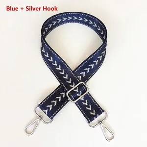 Adjustable blue nylon shoulder strap with white V-pattern and silver metal hooks