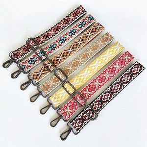 Seven colorful ethnic geometric woven canvas bag straps with dark metal swivel hooks