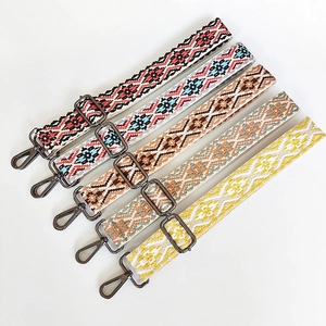 Detail showing five colorful bohemian woven bag straps with metal swivel snap hooks