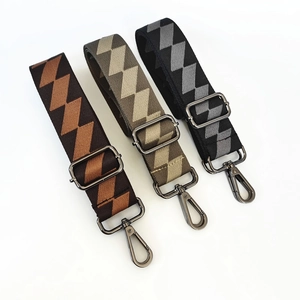 Close-up of adjustable geometric plaid patterned replacement straps with metal hooks