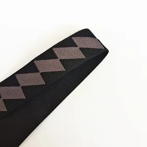 Detailed view of adjustable black and grey diamond pattern strap with metal hooks