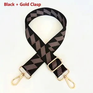 Adjustable black geometric patterned bag strap with durable gold metal lobster hooks