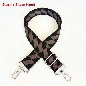 Detailed view of gray geometric diamond pattern backpack strap with silver metal lobster hooks