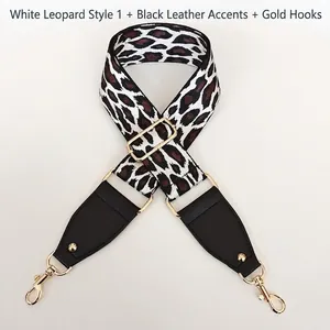 Adjustable leopard print nylon shoulder strap with black leather ends and gold hardware