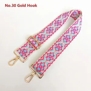 Close-up of geometric bohemian strap with golden metal lobster hooks and adjustable buckle