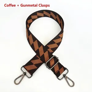 Detail of adjustable brown zigzag woven strap with gunmetal swivel snap hooks