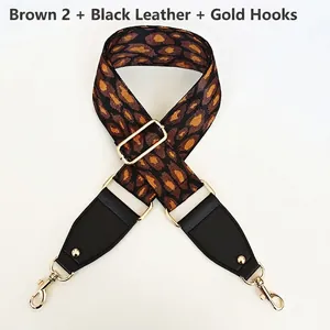 Close-up of brown leopard jacquard wide strap with black leather and gold metal hooks