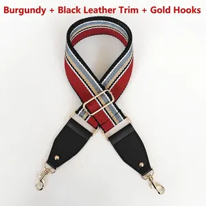 Adjustable burgundy canvas bag strap with colorful stripes and gold metal hardware