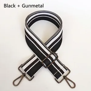 Detail view of adjustable 5cm striped bag strap with gunmetal swivel hooks and metal sliders