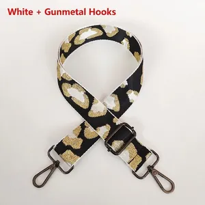 Detail of leopard print bag strap with gunmetal lobster clasp and adjustable buckle