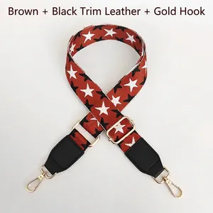 Detail of adjustable brown star pattern strap with gold metal hooks and black leather